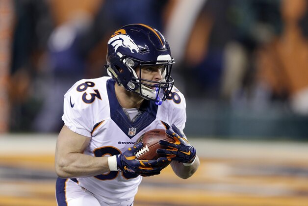 Denver Broncos wide receiver Wes Welker runs with a catch against the Cincinnati Bengals during the first half of an NFL football game Monday, Dec. 22, 2014, in Cincinnati. (AP Photo/Michael Conroy)