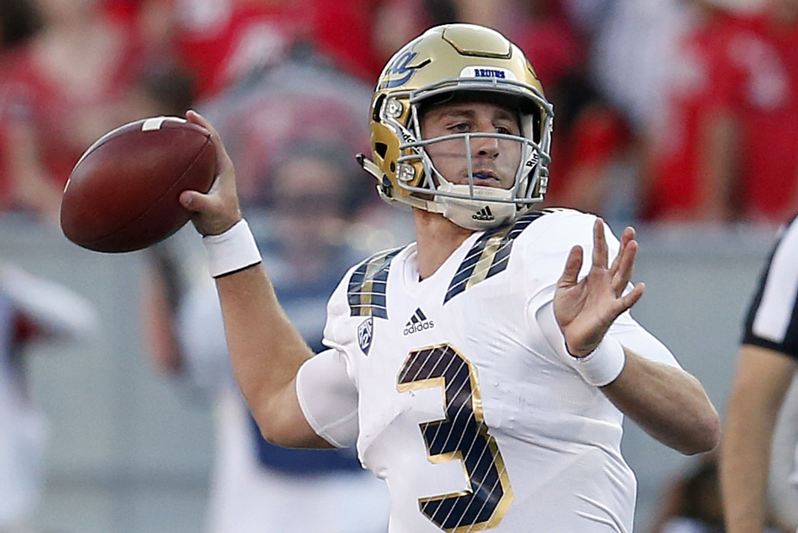 UCLA quarterback Josh Rosen (3) throws down field against UCLA during the first half of an NCAA college football game, Saturday, Sept. 26, 2015, in Tucson, Ariz. (AP Photo/Rick Scuteri)