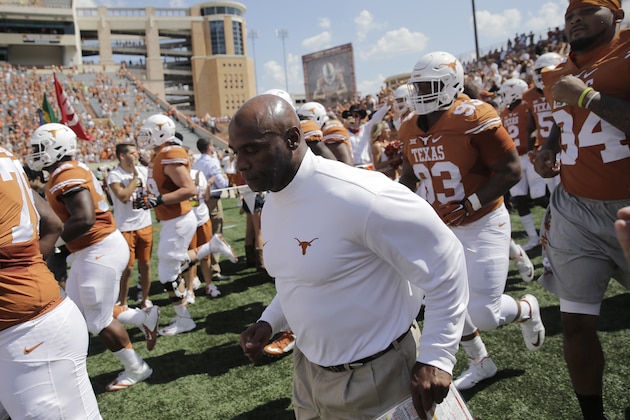 Texas head coach Charlie Strong takes the field with his team before an NCAA college football game against Oklahoma State, Saturday, Sept. 26, 2015, in Austin, Texas. (AP Photo/Eric Gay)