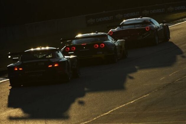 Jorg Muller (55), of Germany, follows Oliver Gavin (4), of England, and Matteo Malucelli (62) during the American Le Mans Series' Petit Le Mans auto race at Road Atlanta, Saturday, Oct. 19, 2013, in Braselton, Ga. (AP Photo/Rainier Ehrhardt)