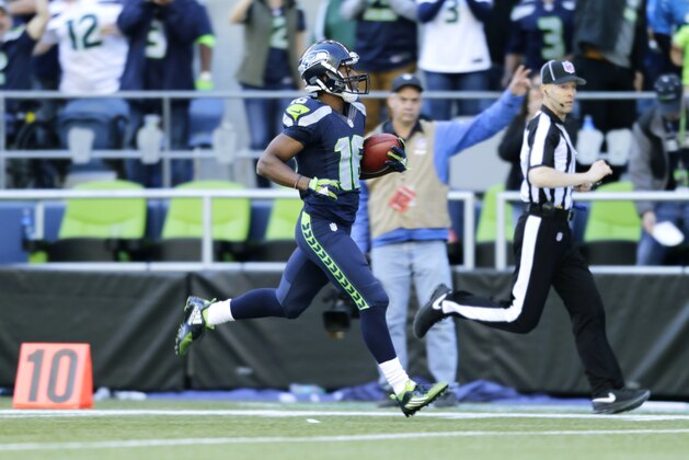 Seattle Seahawks wide receiver Tyler Lockett returns a Chicago Bears kickoff 105 yards for a touchdown in the second half of an NFL football game, Sunday, Sept. 27, 2015, in Seattle. (AP Photo/John Froschauer)