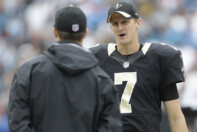 New Orleans Saints' Luke McCown (7) talks with head coach Sean Payton in the second half of an NFL football game against the Carolina Panthers in Charlotte, N.C., Sunday, Sept. 27, 2015. (AP Photo/Bob Leverone)