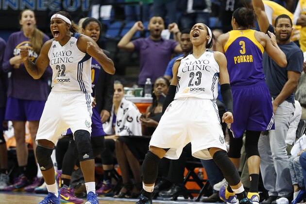 Minnesota Lynx's Rebekkah Brunson (32) and Maya Moore (23) react to a foul call against the Los Angeles Sparks during the second half of Game 3 of a WNBA basketball Western Conference semifinal series, Tuesday, Sept. 22, 2015, in Minneapolis. The Lynx won 91-80. (AP Photo/Stacy Bengs)
