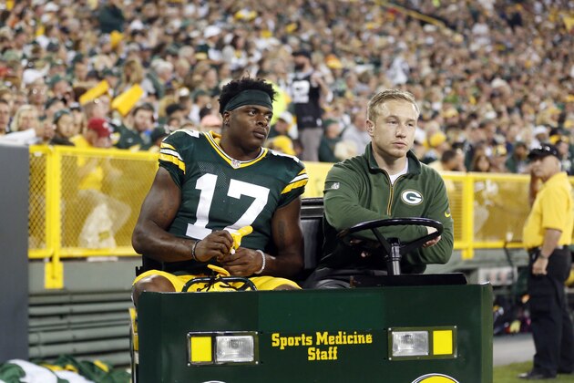 Green Bay Packers' Davante Adams leaves the game on a cart during the first half of an NFL football game against the Seattle Seahawks Sunday, Sept. 20, 2015, in Green Bay, Wis. (AP Photo/Jeffrey Phelps)