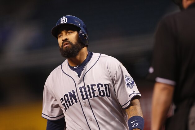 San Diego Padres' Matt Kemp (27) reacts after fouling off a pitch against Colorado Rockies starting pitcher Chad Bettis in the first inning of a baseball game Friday, Sept. 18, 2015, in Denver. (AP Photo/David Zalubowski)