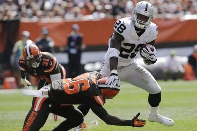 Oakland Raiders running back Latavius Murray (28) is tackled by Cleveland Browns cornerback Pierre Desir (26) in the second half of an NFL football game, Sunday, Sept. 27, 2015, in Cleveland. (AP Photo/Aaron Josefczyk)