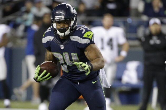 Seattle Seahawks running back Thomas Rawls carries the ball against the Oakland Raiders in the second half of a preseason NFL football game, Thursday, Sept. 3, 2015, in Seattle. (AP Photo/Elaine Thompson)