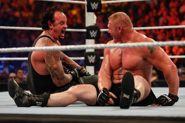 NEW YORK, NY - AUGUST 23:  Brock Lesnar and The Undertaker battle it out at the WWE SummerSlam 2015 at Barclays Center of Brooklyn on August 23, 2015 in New York City.  (Photo by JP Yim/Getty Images)