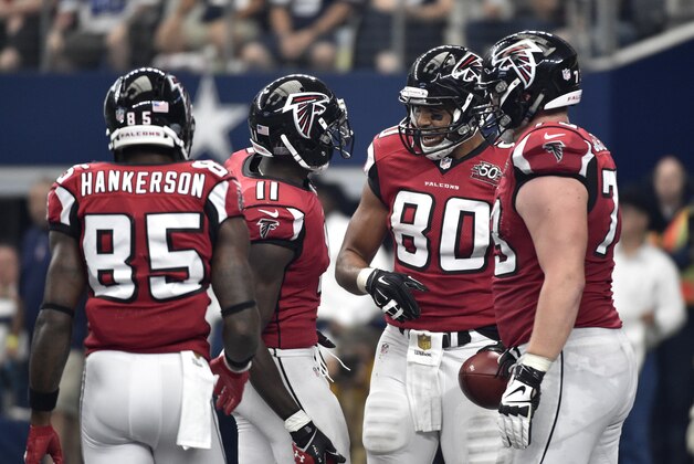 Atlanta Falcons' Leonard Hankerson (85), Julio Jones (11), Levine Toilolo (80) and Ricky Heimuli celebrate a score against the Dallas Cowboys during an NFL football game Sunday, Sept. 27, 2015, in Arlington, Texas. (AP Photo/Michael Ainsworth)