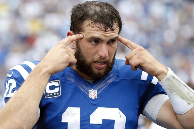 Indianapolis Colts quarterback Andrew Luck talks with teammates on the sideline in the second half of an NFL football game against the Tennessee Titans Sunday, Sept. 27, 2015, in Nashville, Tenn. The Colts won 35-33. (AP Photo/Weston Kenney)
