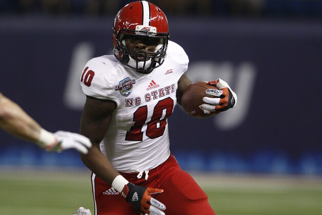 Dec 26, 2014; St. Petersburg, FL, USA; North Carolina State Wolfpack running back Shadrach Thornton (10) runs the ball against the Central Florida Knights during the first half in the 2014 St. Petersburg Bowl at Tropicana Field. Mandatory Credit: Mark Zerof-USA TODAY Sports