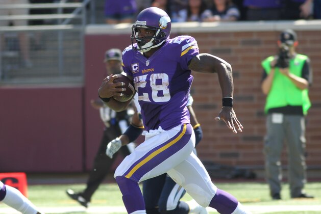 Minnesota Vikings running back Adrian Peterson (28) runs for a touchdown against the San Diego Chargers in the second half of an NFL football game in Minneapolis, Sunday, Sept. 27, 2015.  (AP Photo/Andy Clayton-King)