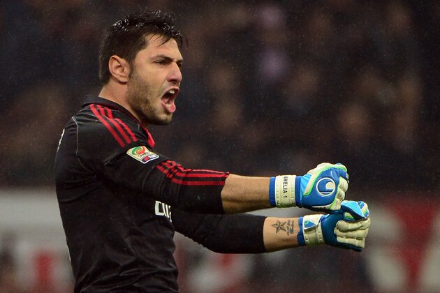 AC Milan's goalkeeper Marco Amelia celebrates after the Italian serie A football match between AC Milan and Juventus on November 25, 2012 at the San Siro stadium in Milan. AFP PHOTO / OLIVIER MORIN        (Photo credit should read OLIVIER MORIN/AFP/Getty Images)