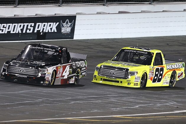 Erik Jones (4) leads Matt Crafton (88) down the back straight during the NASCAR Truck Series auto race at Gateway Motorsports Park on Saturday, June 13, 2015, in Madison, Ill. (AP Photo/Scott Kane)