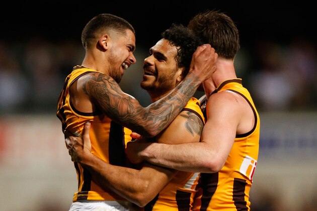 PERTH, AUSTRALIA - SEPTEMBER 25: (L-R) Bradley Hill, Cyril Rioli and Matthew Suckling of the Hawks celebrate during the 2015 AFL First Preliminary Final match between the Fremantle Dockers and the Hawthorn Hawks at Domain Stadium, Perth, Australia on September 25, 2015. (Photo by Michael Willson/AFL Media/Getty Images)