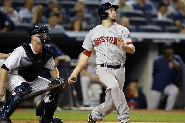 New York Yankees catcher Brian McCann, left, watches as Boston Red Sox Blake Swihart follows through on a two-run home run during the eighth inning a baseball game in New York, Tuesday, Sept. 29, 2015.  (AP Photo/Kathy Willens)