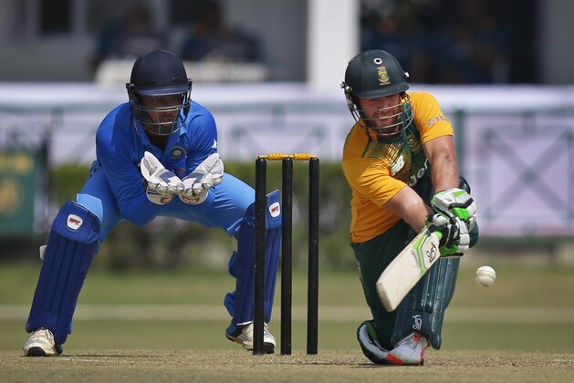 South African batsman AB de Villiers sweeps a ball against India A during a practice Twenty20 match in New Delhi, India, Tuesday, Sept. 29, 2015. South Africa will play three Twenty20, five one-day internationals and four test matches during their 72 day tour of India. (AP Photo/Saurabh Das)