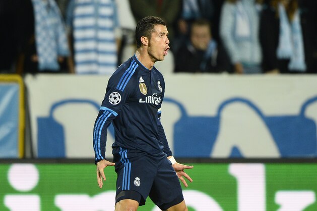 Real Madrids Cristiano Ronaldo celebrates after scoring the opening goal during the UEFA Champions League group A football match between Malmo FF and Real Madrid at Malmo New Stadium in Malmo, Sweden, Wednesday Sept. 30, 2015. (Anders Wiklund / TT via AP) SWEDEN OUT