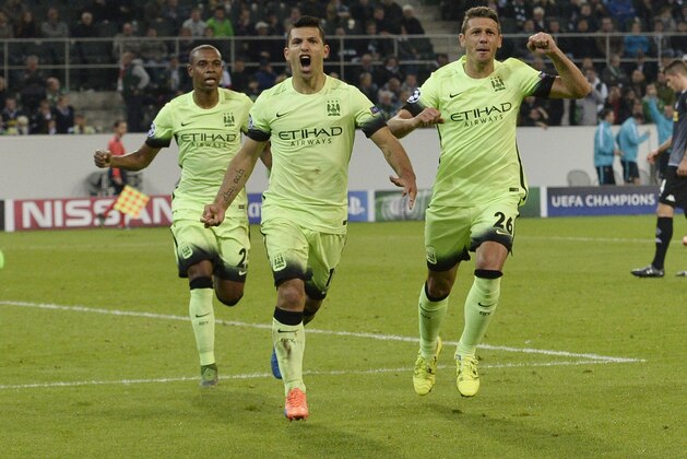 Manchester City's Sergio Agüero, center, celebrates his side's second goal during the Champions League group D soccer match between Borussia Moenchengladbach and Manchester City in Moenchengladbach, Germany, Wednesday, Sept. 30, 2015. (AP Photo/Martin Meissner)