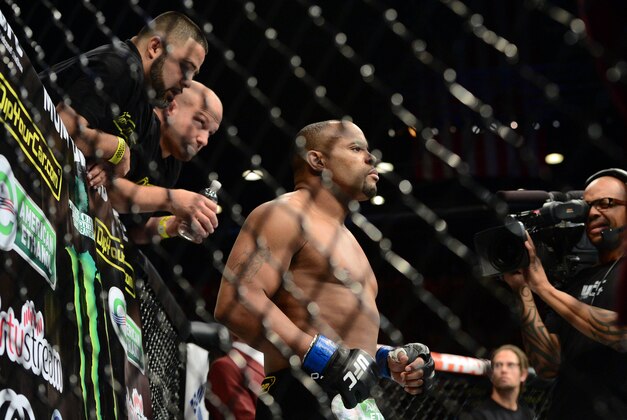 May 23, 2015; Las Vegas, NV, USA;  Daniel Cormier (blue gloves) is introduced against Anthony Johnson (not pictured) for their light heavyweight championship bout during UFC 187 at MGM Grand Garden Arena. Cormier won via third round TKO. Mandatory Credit: Joe Camporeale-USA TODAY Sports