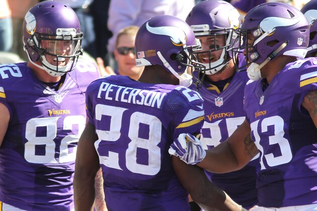 Minnesota Vikings running back Adrian Peterson (28) celebrates a touchdown against the San Diego Chargers in the second half of an NFL football game in Minneapolis, Sunday, Sept. 27, 2015.  (AP Photo/Andy Clayton-King)