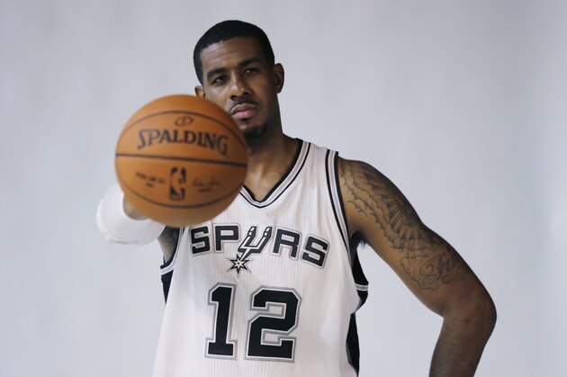 San Antonio Spurs' LaMarcus Aldridge (12) poses for photos during media day at the team's practice facility, Monday, Sept. 28, 2015, in San Antonio. (AP Photo/Eric Gay)