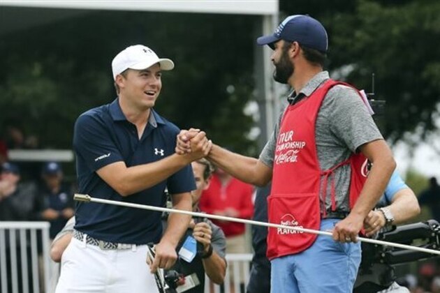 CORRECTS SPELLING TO SPIETH, INSTEAD OF SPEITH  - Jordan Spieth, left, celebrates with his caddie after winning the Tour Championship golf tournament and the FedEx Cup at East Lake Golf Club, Sunday, Sept. 27, 2015, in Atlanta. (AP Photo/John Bazemore)
