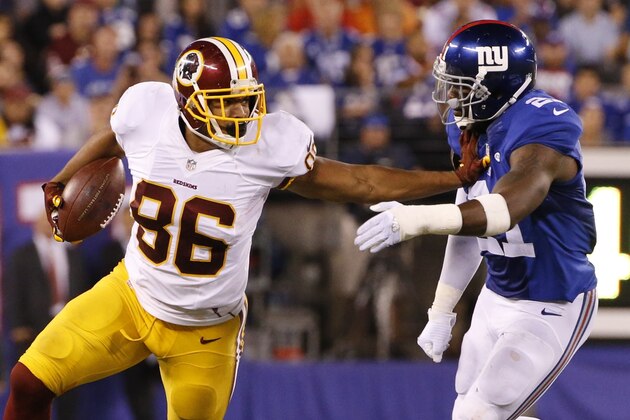 Washington Redskins' Jordan Reed (86) stiff arms New York Giants' Landon Collins (21) during the second half an NFL football game Thursday, Sept. 24, 2015, in East Rutherford, N.J. (AP Photo/Kathy Willens)