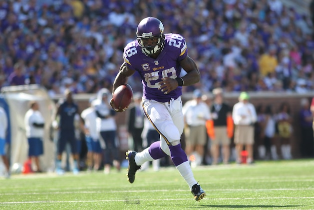 Minnesota Vikings running back Adrian Peterson (28) runs against the San Diego Chargers in the second half of an NFL football game in Minneapolis, Sunday, Sept. 27, 2015.  (AP Photo/Andy Clayton-King)
