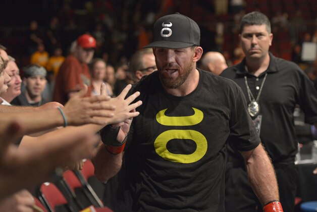 Aug 16, 2014; Bangor, ME, USA; Ryan Bader (red gloves) leaves the octagon after defeating Ovince Saint Preux (blue gloves not pictured) during light heavyweight bout at Cross Insurance Center. Mandatory Credit: Gregory J. Fisher-USA TODAY Sports