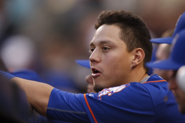 New York Mets shortstop Wilmer Flores (4) in the top of the third inning of a baseball game Saturday, Aug. 22, 2015, in Denver. (AP Photo/David Zalubowski)