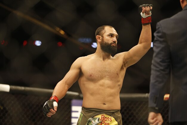 Mar 14, 2015; Dallas, TX, USA; Johny Hendricks (red) defeats Matt Brown (blue) in a welterweight bout during UFC 185 at American Airlines Center. Mandatory Credit: Tim Heitman-USA TODAY Sports