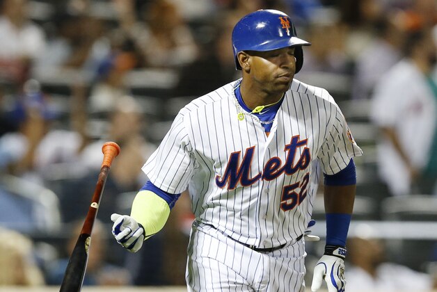 New York Mets Yoenis Cespedes drops his bat after hitting a third-inning, solo home run in a baseball game against the Miami Marlins in New York, Monday, Sept. 14, 2015. (AP Photo/Kathy Willens)