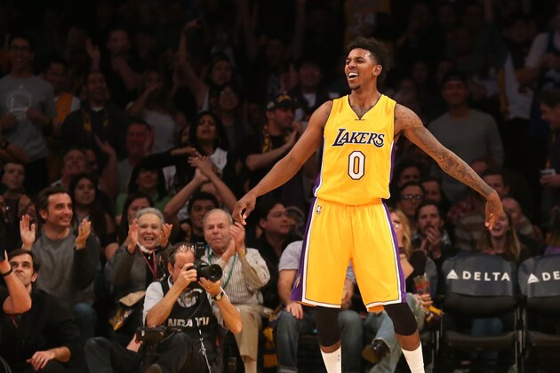 LOS ANGELES, CA - DECEMBER 23:  Nick Young #0 of the Los Angeles Lakers reacts after making a three point shot against the Golden State Warriors at Staples Center on December 23, 2014 in Los Angeles, California.  NOTE TO USER: User expressly acknowledges and agrees that, by downloading and or using this photograph, User is consenting to the terms and conditions of the Getty Images License Agreement.  (Photo by Stephen Dunn/Getty Images)