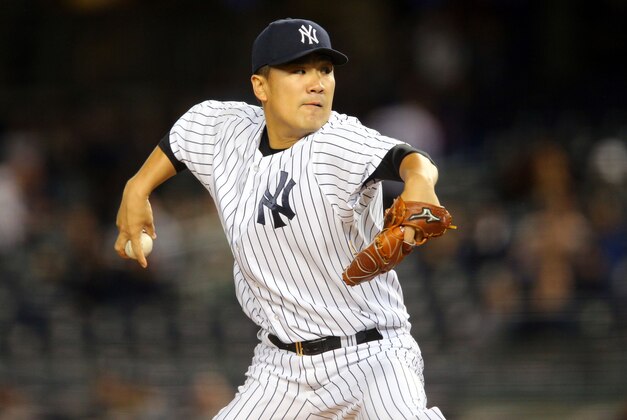 Sep 30, 2015; Bronx, NY, USA; New York Yankees starting pitcher Masahiro Tanaka (19) pitches against the Boston Red Sox during the first inning at Yankee Stadium. Mandatory Credit: Brad Penner-USA TODAY Sports