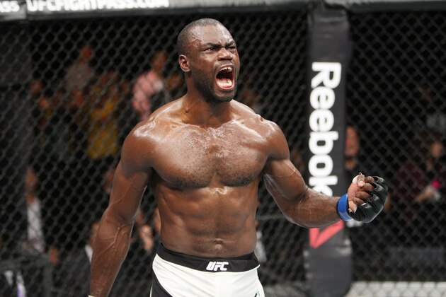 SAITAMA, JAPAN - SEPTEMBER 27:  Uriah Hall of Jamaica celebrates his win over Gegard Mousaasi of Iran in their middleweight bout during the UFC event at the Saitama Super Arena on September 27, 2015 in Saitama, Japan. (Photo by Mitch Viquez/Zuffa LLC/Zuffa LLC via Getty Images)