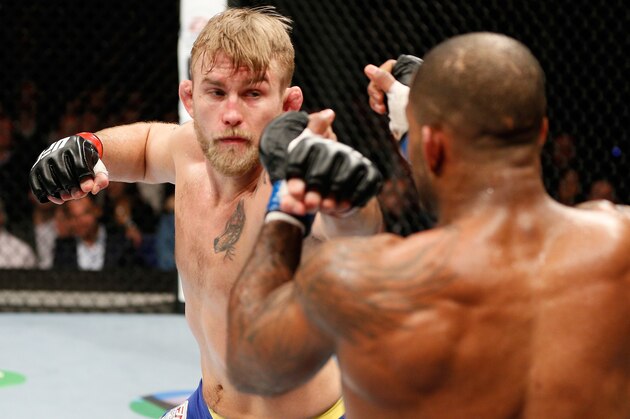 LONDON, ENGLAND - MARCH 08:  (L-R) Alexander Gustafsson punches Jimi Manuwa in their light heavyweight fight during the UFC Fight Night London event at the O2 Arena on March 8, 2014 in London, England. (Photo by Josh Hedges/Zuffa LLC/Zuffa LLC via Getty Images)