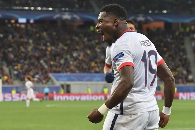 Paris Saint-Germain's Ivorian defender Serge Aurier celebrates after scoring a goal during the UEFA Champions League group A football match between Shakhtar Donetsk and Paris Saint-Germain at the Arena Lviv, in the Ukrainian city of Lviv, on September 30, 2015.   AFP PHOTO / SERGEI SUPINSKY        (Photo credit should read SERGEI SUPINSKY/AFP/Getty Images)