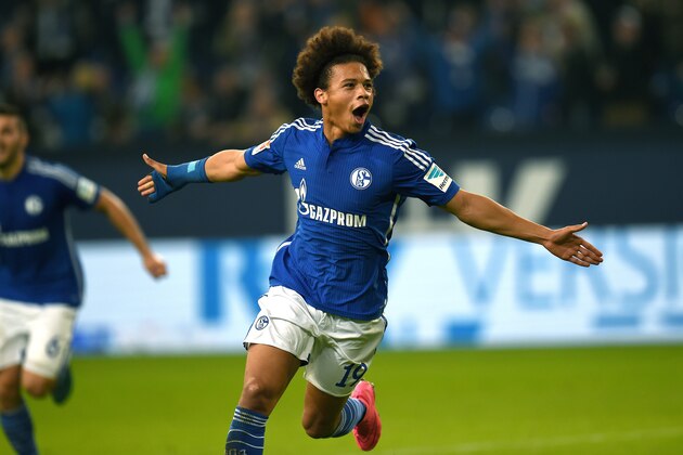 Schalke's midfielder Leroy Sane celebrates during the German first division Bundesliga football match FC Schalke 04 v Eintracht Frankfurt in Gelsenkirchen, on September 23, 2015.    AFP PHOTO / PATRIK STOLLARZ

RESTRICTIONS: DURING MATCH TIME: DFL RULES TO LIMIT THE ONLINE USAGE TO 15 PICTURES PER MATCH AND FORBID IMAGE SEQUENCES TO SIMULATE VIDEO. 
==RESTRICTED TO EDITORIAL USE ==
FOR FURTHER QUERIES PLEASE  CONTACT THE  DFL DIRECTLY AT + 49 69 650050.        (Photo credit should read PATRIK STOLLARZ/AFP/Getty Images)