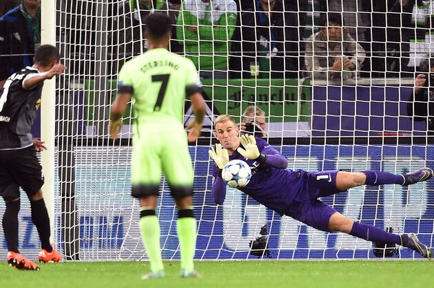 Manchester City's goalkeeper Joe Hart saves a penalty shot by Moenchengladbach's Raffael, left,  during the Champions League group D soccer match between Borussia Moenchengladbach and Manchester City in Moenchengladbach, Germany, Wednesday, Sept. 30, 2015. (AP Photo/Sebastian Konopka)