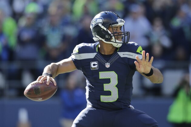 Seattle Seahawks quarterback Russell Wilson passes against the Chicago Bears in the second half of an NFL football game, Sunday, Sept. 27, 2015, in Seattle. (AP Photo/John Froschauer)