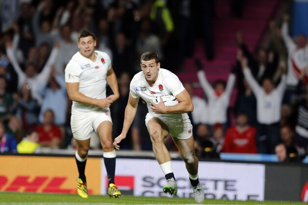 England's Jonny May scores a try during the Rugby World Cup Pool A match between England and Wales at Twickenham Stadium, London, Saturday, Sept. 26, 2015. (AP Photo/Frank Augstein)