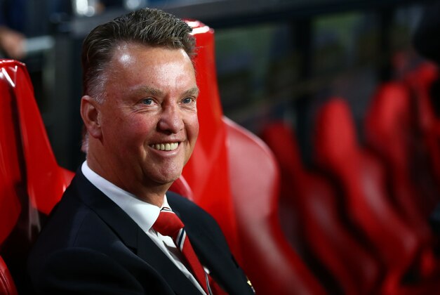 Manchester United's manager Louis van Gaal smiles prior the Champions League Group B soccer match between PSV and Manchester United at Philips stadium in Eindhoven, Netherlands, Tuesday, Sept. 15, 2015. (AP Photo/Peter Dejong)