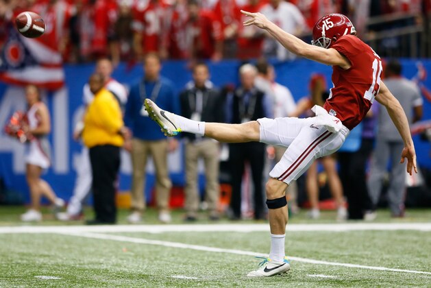 NEW ORLEANS, LA - JANUARY 01:  JK Scott #15 of the Alabama Crimson Tide kicks the ball against the Ohio State Buckeyes during the All State Sugar Bowl at the Mercedes-Benz Superdome on January 1, 2015 in New Orleans, Louisiana.  (Photo by Kevin C. Cox/Getty Images)