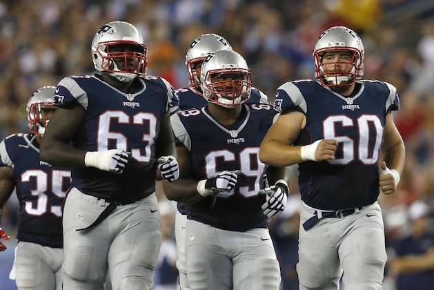 New England Patriots offensive guard Tre Jackson (63), center Shaq Mason (69) and center David Andrews (60) during an NFL preseason football game against the Green Bay Packers, Thursday, Aug. 13, 2015, in Foxborough, Mass. (AP Photo/Michael Dwyer)