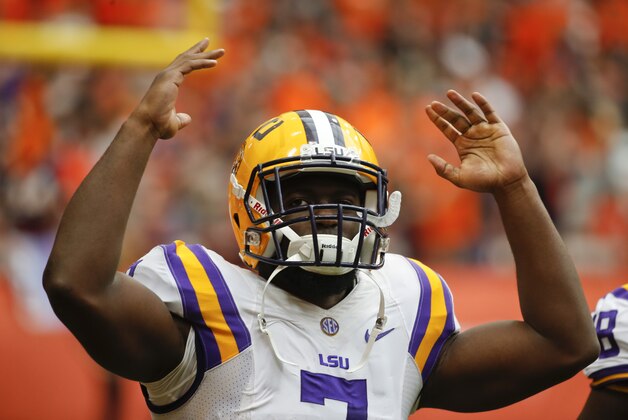LSU running back Leonard Fournette (7) signals to fans during the first half of an NCAA college football game against Syracuse on Saturday, Sept. 26, 2015, in Syracuse, N.Y. (AP Photo/Mike Groll)