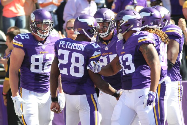 Minnesota Vikings running back Adrian Peterson (28) celebrates a touchdown against the San Diego Chargers in the second half of an NFL football game in Minneapolis, Sunday, Sept. 27, 2015.  (AP Photo/Andy Clayton-King)