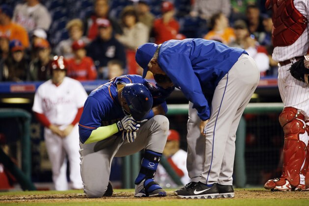 New York Mets' Yoenis Cespedes reacts after being hit by a pitch from Philadelphia Phillies' Justin De Fratus during the third inning of a baseball game, Wednesday, Sept. 30, 2015, in Philadelphia. (AP Photo/Matt Slocum)