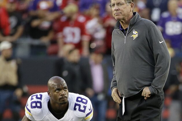Minnesota Vikings running back Adrian Peterson (28) stretches next to offensive coordinator Norv Turner before an NFL football game against the San Francisco 49ers in Santa Clara, Calif., Monday, Sept. 14, 2015. (AP Photo/Marcio Jose Sanchez)