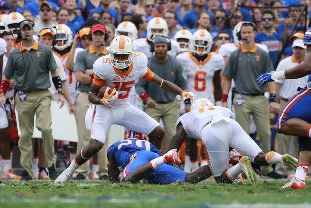 Sep 26, 2015; Gainesville, FL, USA; Tennessee Volunteers wide receiver Jauan Jennings (15) runs past Tennessee Volunteers linebacker Cortez McDowell (20)  during the first half at Ben Hill Griffin Stadium. Mandatory Credit: Kim Klement-USA TODAY Sports